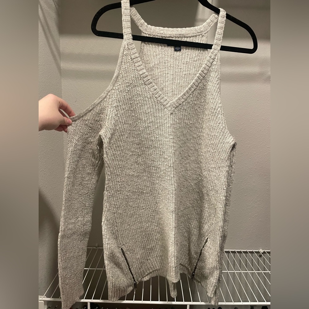 light-gray open shoulder sweater with front zipper detail